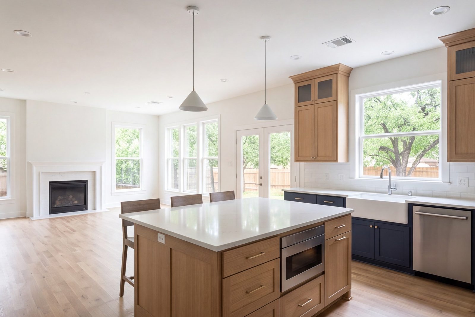 Irving family kitchen with a large island open to a sunny family room