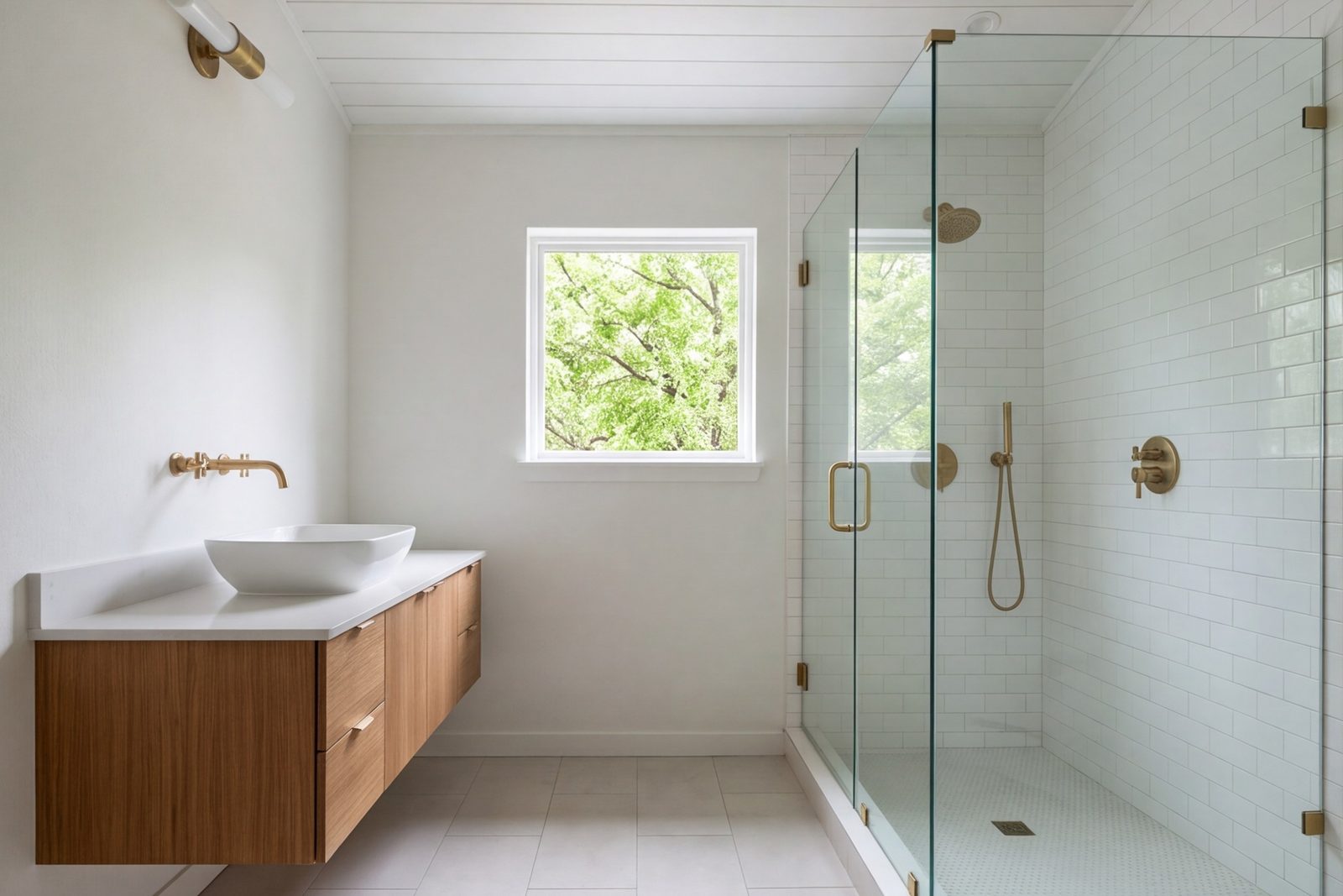 Small hall bathroom with a frameless glass shower and a floating vanity